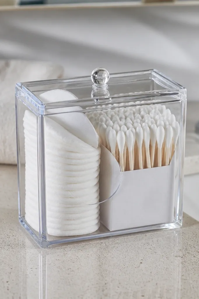 Clear container with lid holding cotton rounds and swabs with a neat insert