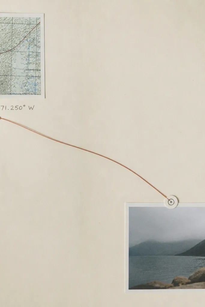 A minimalist page with a small printed map square in the top-left. Coordinates are typed or handwritten near it. A thin thread line runs from the coordinates toward a small photo in the lower right. A small circle label marks the photo spot.
