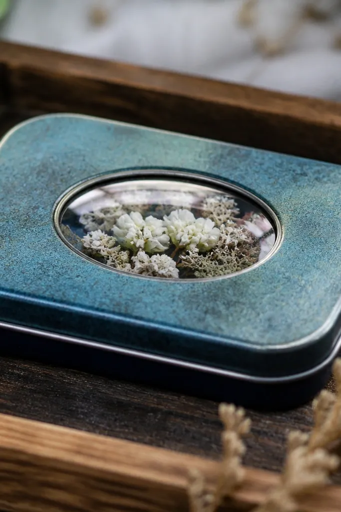 Clear glossy epoxy dome on a sealed Altoids tin label area
