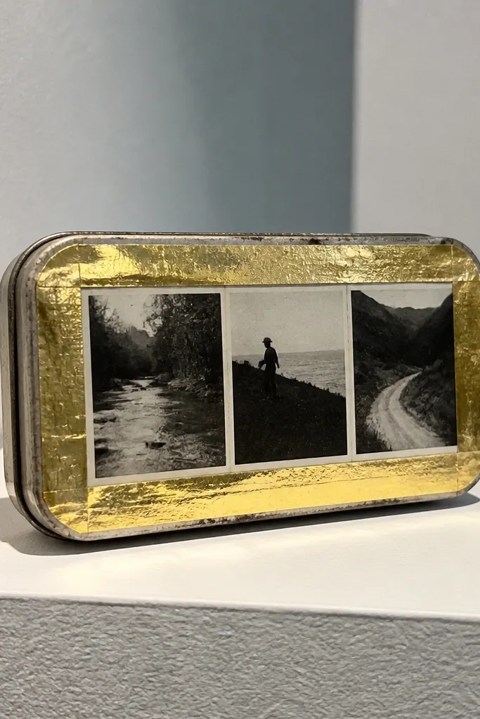 Altoids wallet with gold foil tape border and a black-and-white strip