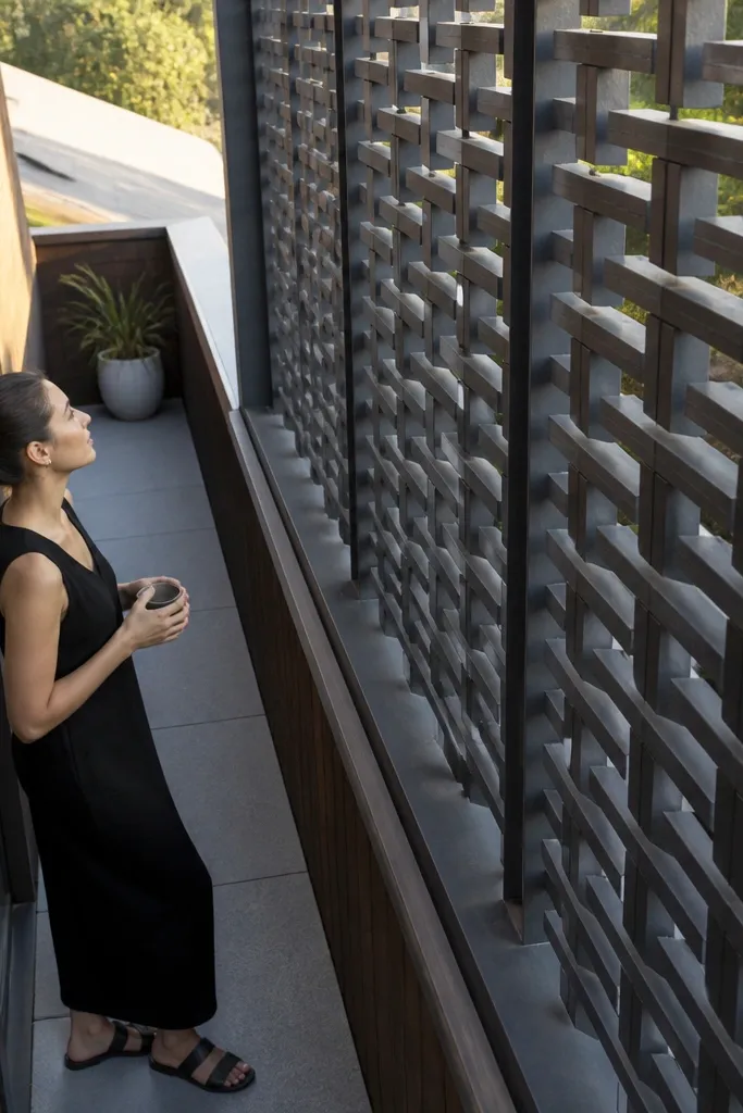 Wood lattice panels with large square openings on a compact balcony railing