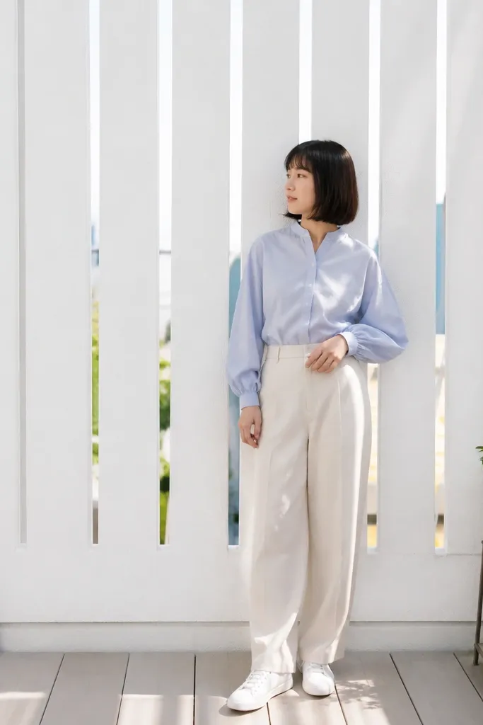 Matte white panels with vertical slits for an airy railing look