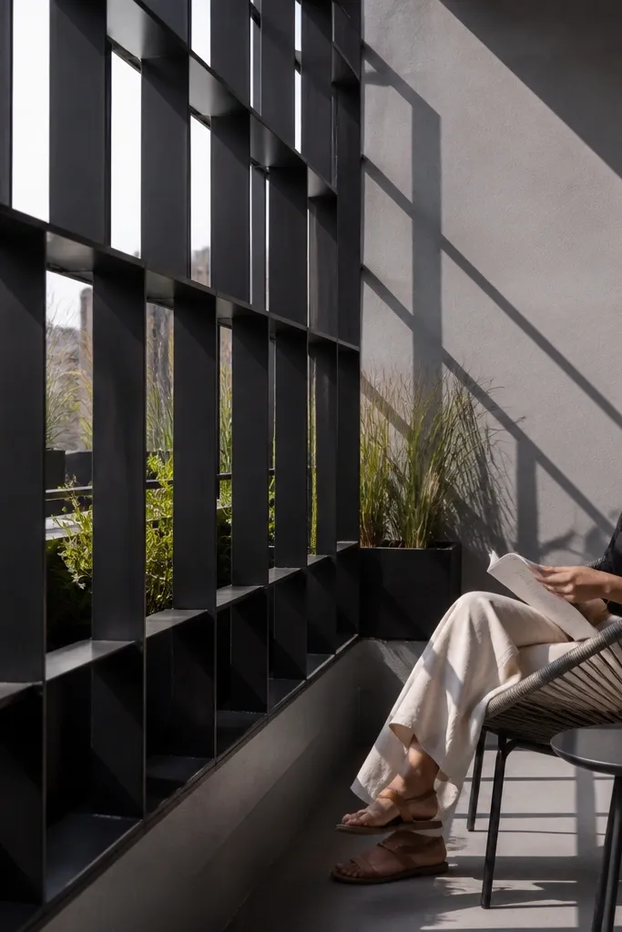 Black angle steel grid railing with open rectangle openings