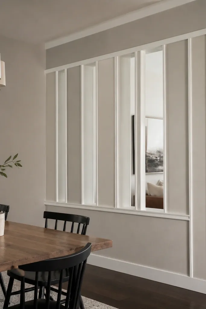 Half wall with tall vertical framed panels and a thin top rail
