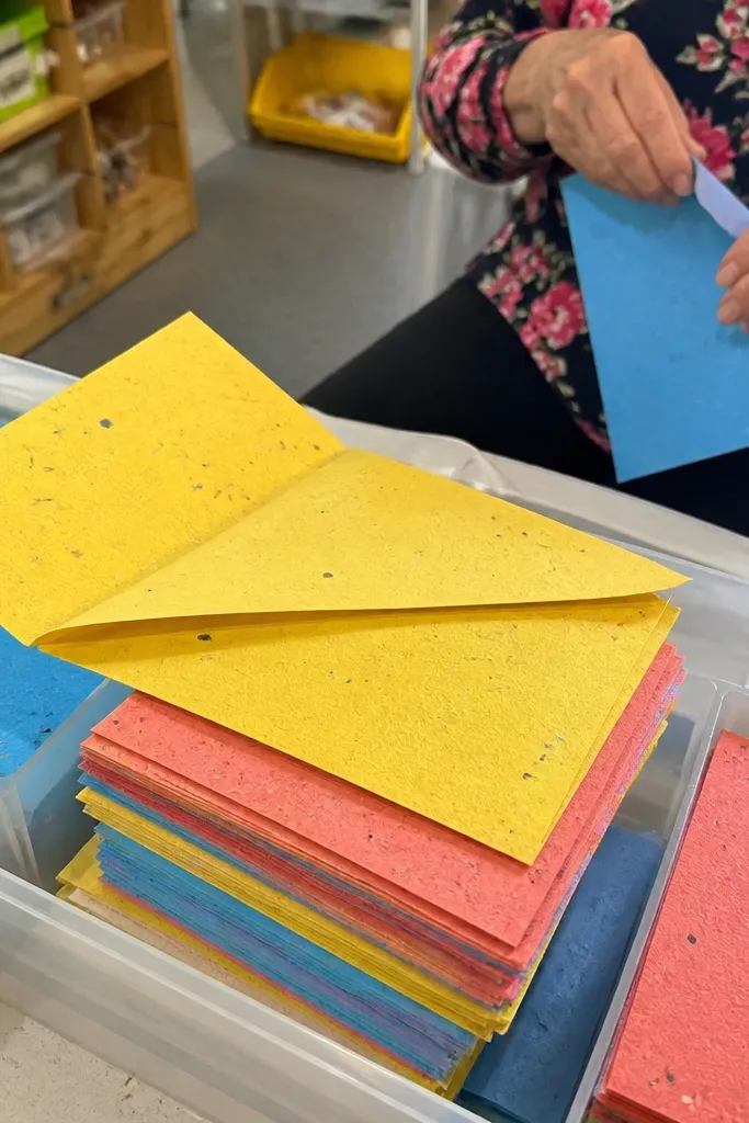 Multicolored square craft paper with a slightly uneven surface