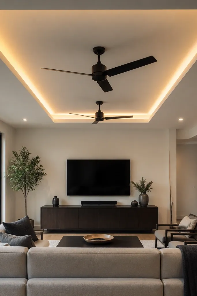 A recessed rectangular tray ceiling with two fans mounted inside the lowered area.
