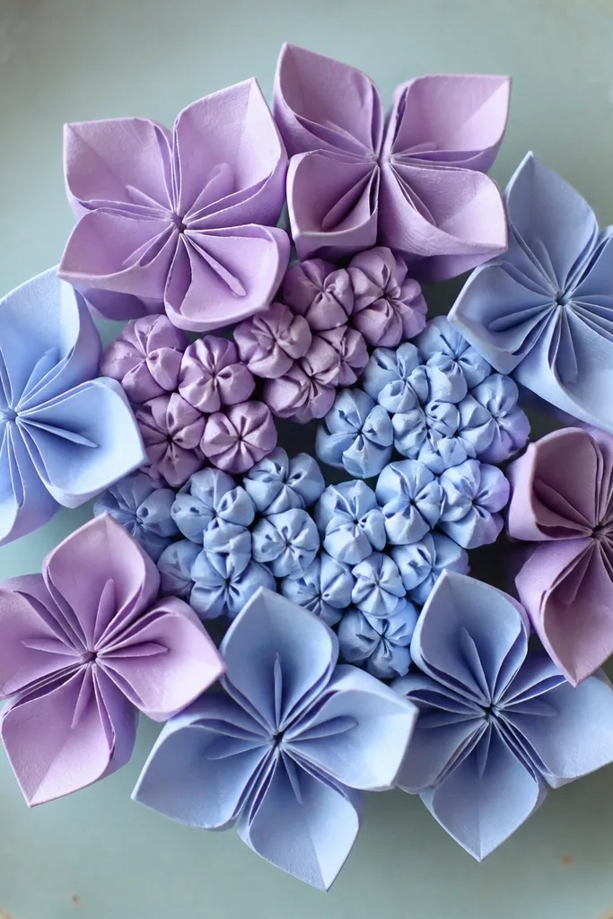 A hydrangea-like flower with puffy layered rings in pastel colors