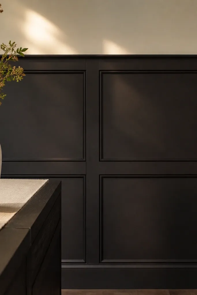 Dark picture-frame wainscoting with evenly spaced square frames