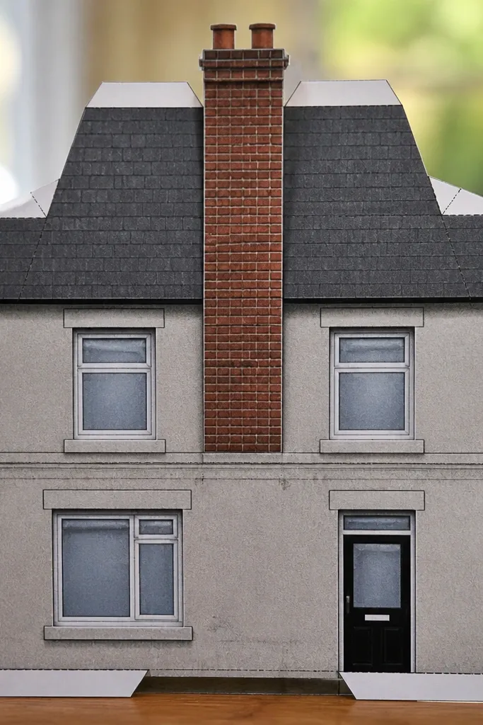 Paper doll row house with brick chimney and a front mail slot