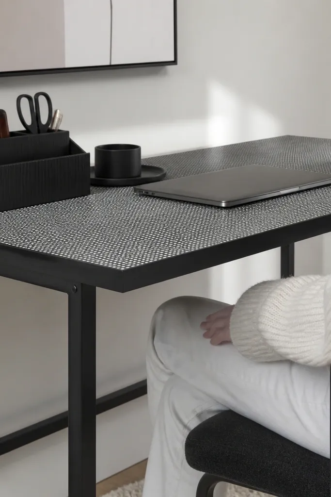 Black-and-white vinyl pattern desktop on simple desk base