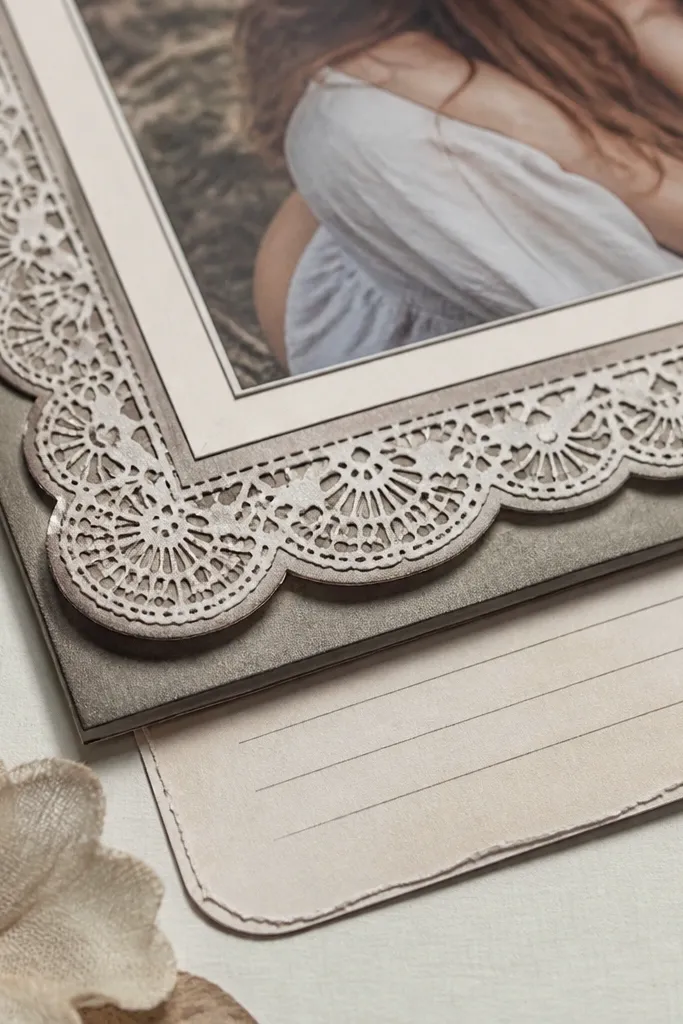 Scalloped vintage lace border in black-brown ink with repeating pattern