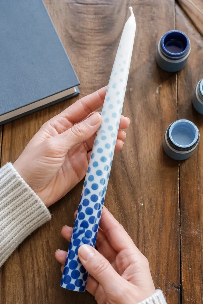 Candle with ombre dots fading from dark to light