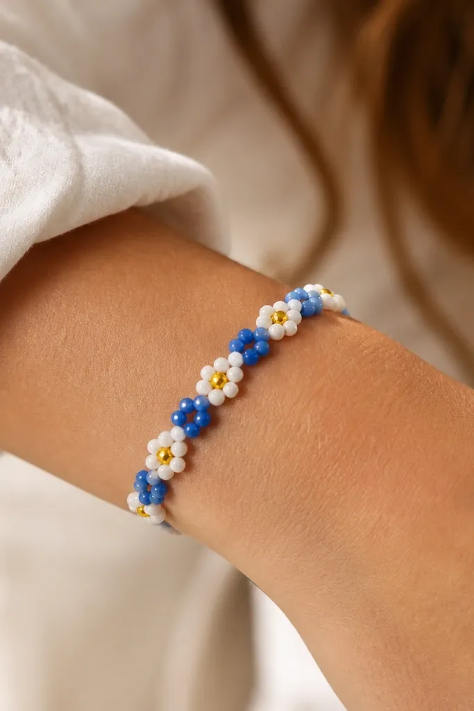 A bracelet with alternating blue and white beads, plus small yellow center beads that create a sunburst effect across the wrist.