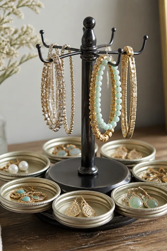 A small rotating turntable with several jar lids attached around the edge. Earrings rest in lid sections, and bracelets hang from small hooks on top.