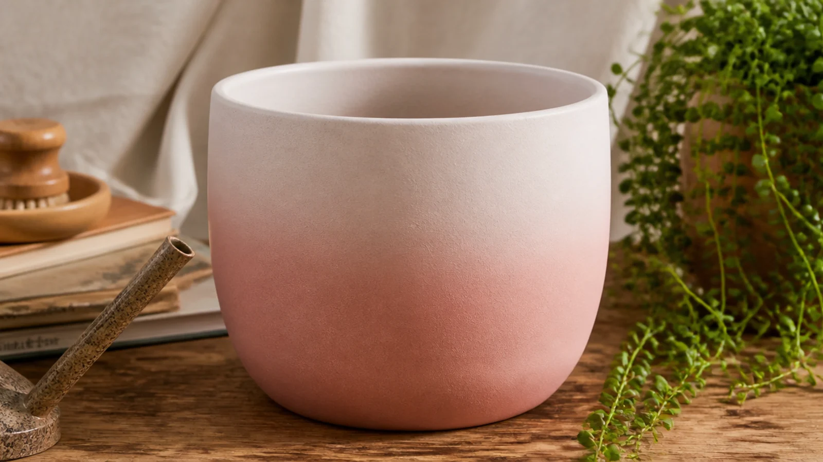 A clay pot with a soft blush-to-white gradient, blush strongest at the base and fading gently upward.