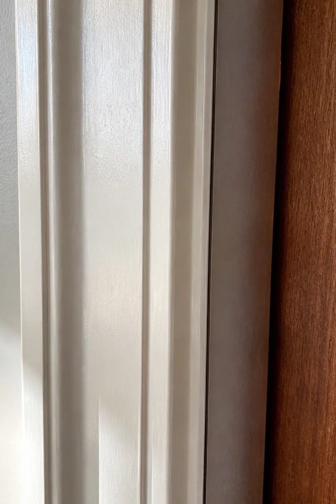 Even door casing reveals with straight caulk lines and consistent trim thickness