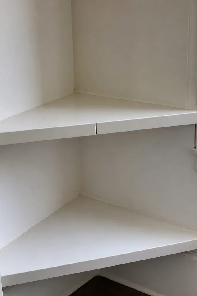Two corner shelf pieces with a visible gap at the seam
