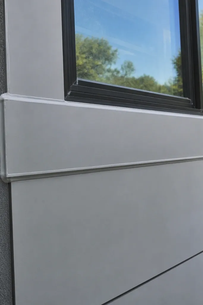 Facade with trim sealed shut leaving no way to remove panels