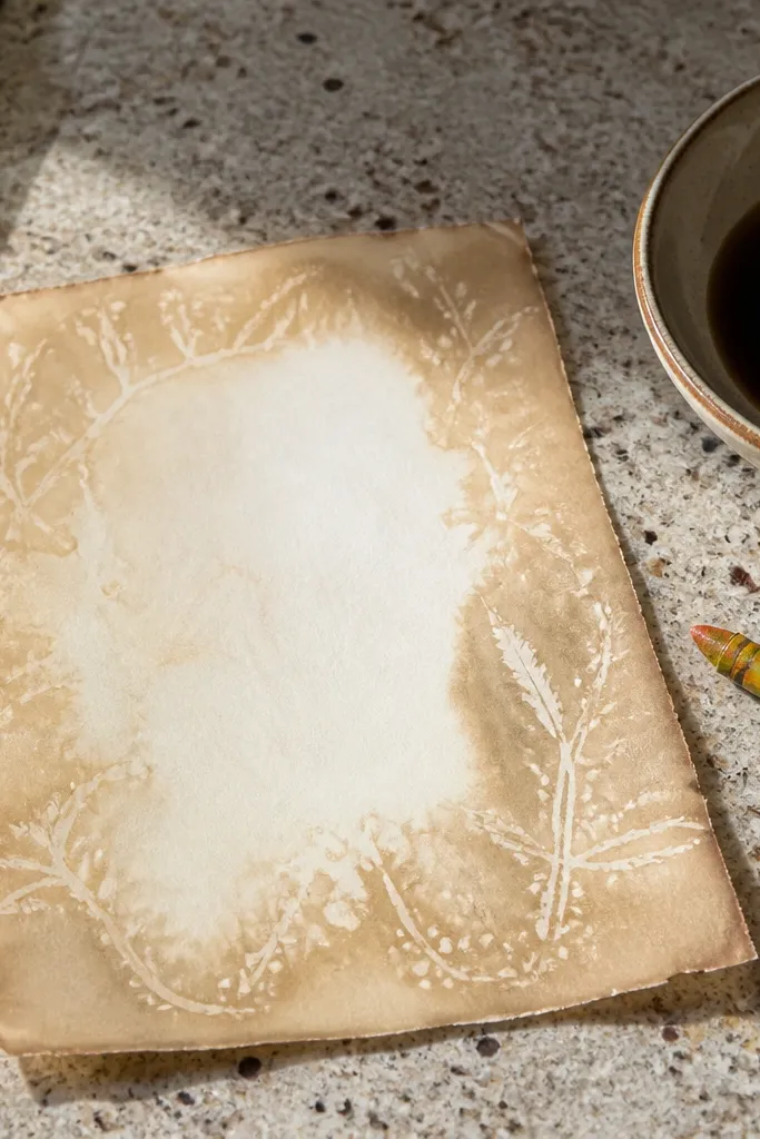 Aged paper with lighter waxy smudges that look like old highlights.