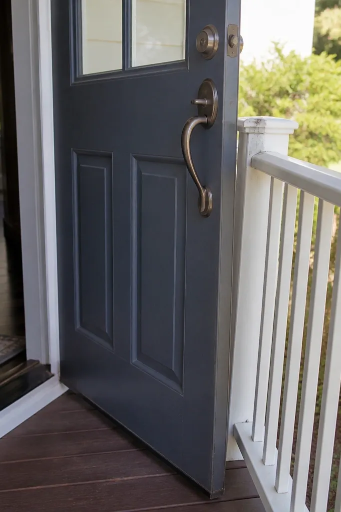 Door hitting porch railing when opened wide