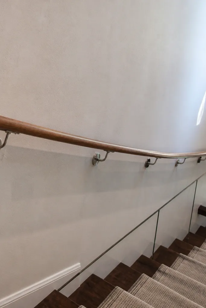 Wall stud layout with a handrail bracket mounted between supports
