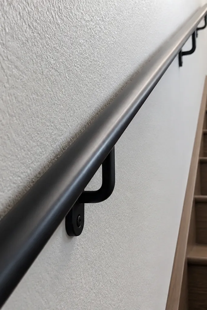 Handrail close to a wall with a spacer gap shown