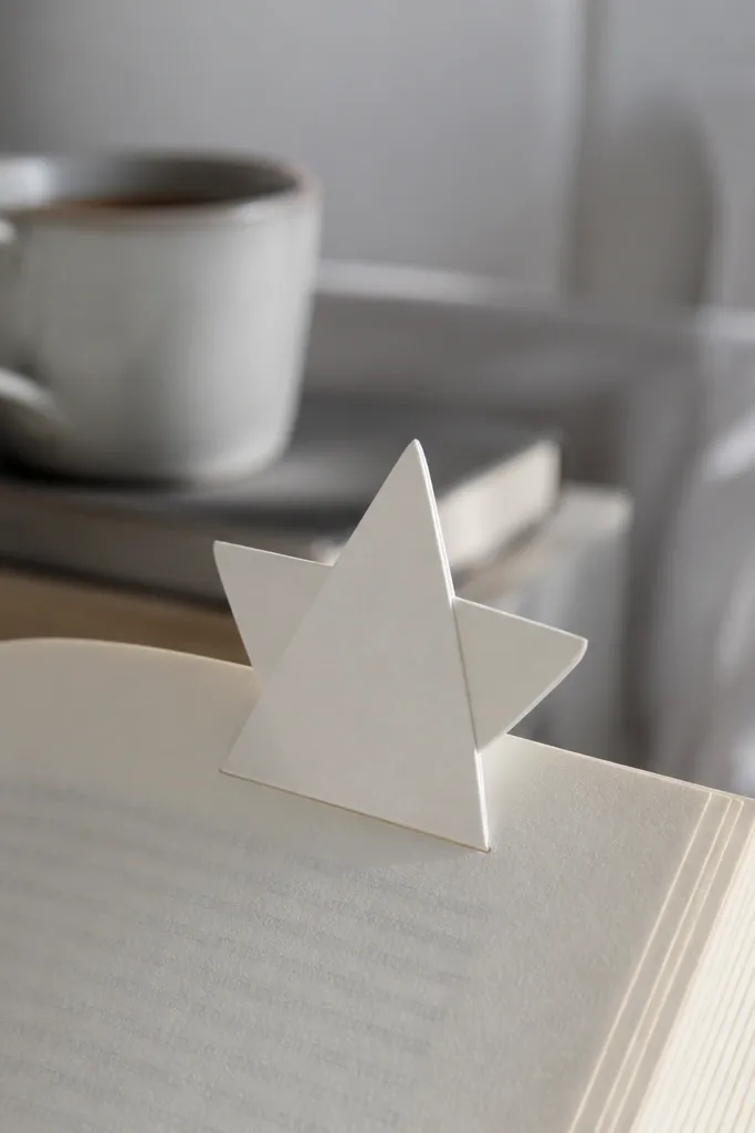 Folded paper star shape with a pointed bookmark tab
