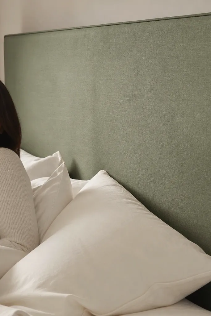 Fabric upholstered headboard with sharp, straight edges