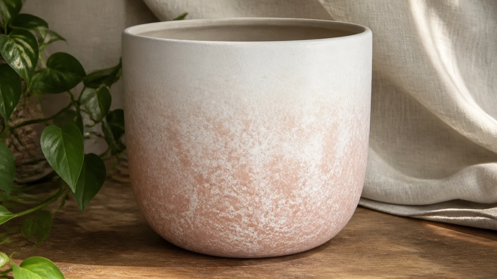 A pot with a soft blush-to-white gradient, blush concentrated at the bottom and fading upward, blended with a sponged texture.