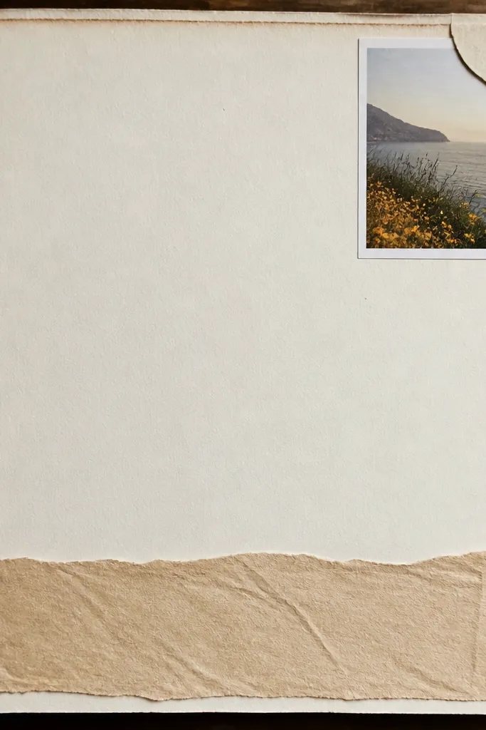 A page with a small square photo tucked into the top-right corner under a paper tab; a long journaling strip runs along the bottom.