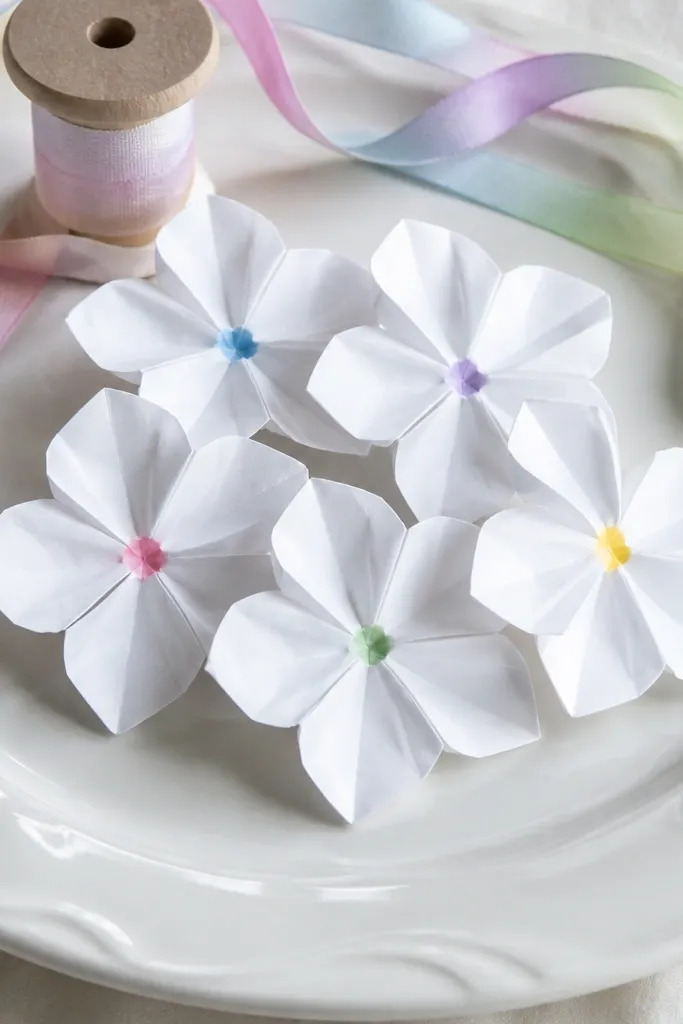 Small white hydrangea cluster origami flowers grouped together