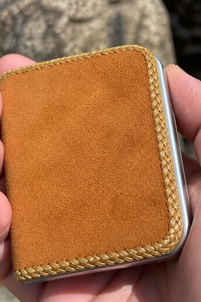 Saffron suede-look Altoids wallet with a braided edge strip along the rim