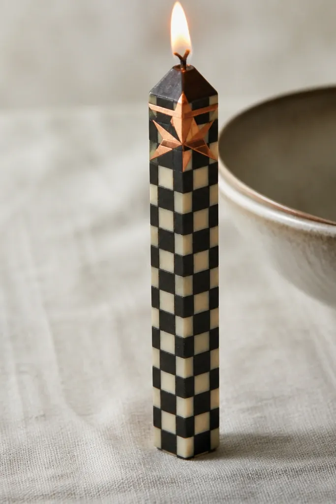 Cream taper with black checker panels and one copper star near the top corner