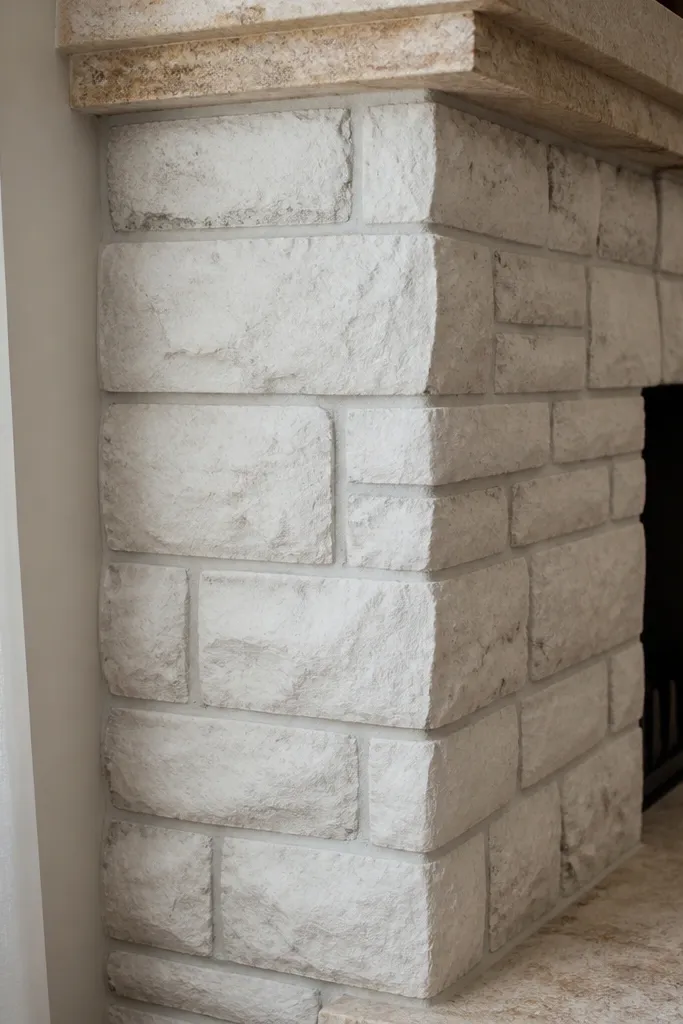 Warm white painted stone with faint gray recess shading