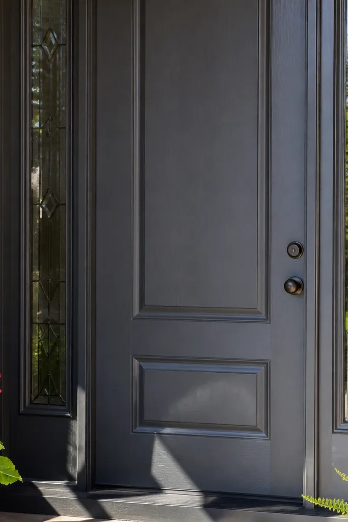 Charcoal front door with matte finish and matching black hardware