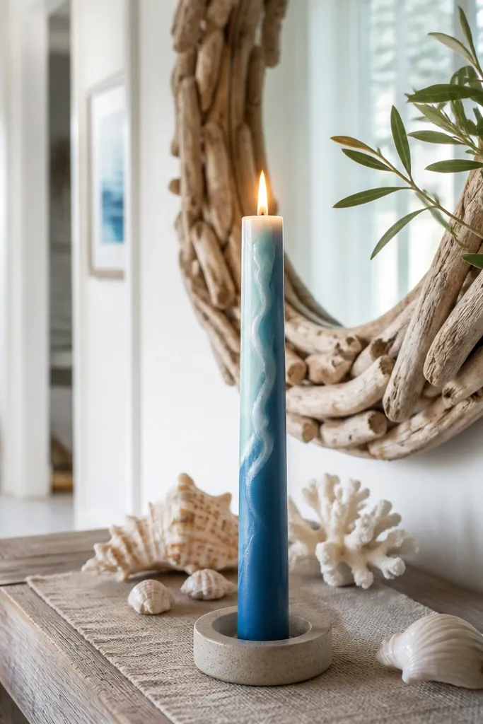 Taper candle with a wavy seafoam line across a blue base