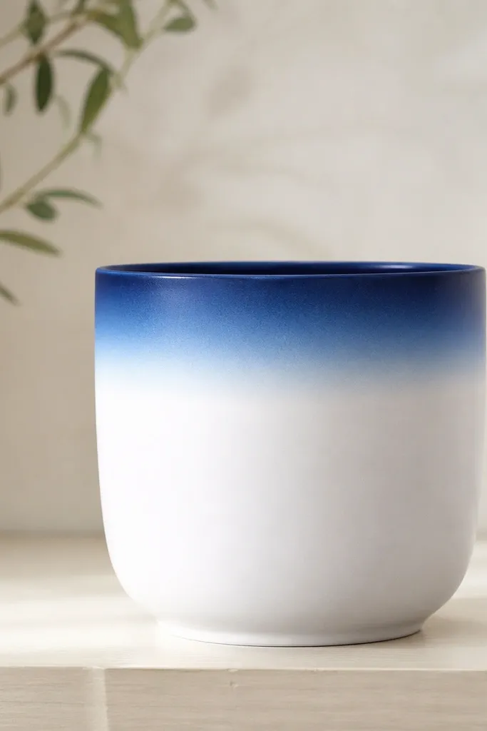 A white pot with a smooth ombre band at the top rim fading from deep navy to light sky blue; the rest of the pot stays plain white.