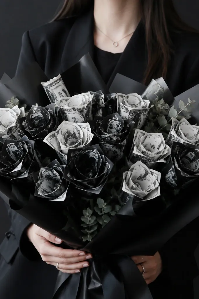 Black-and-white money bouquet with contrast petals and minimal greenery