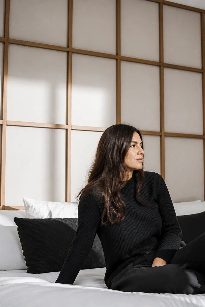 Minimal wood grid headboard with thin bars on a neutral background