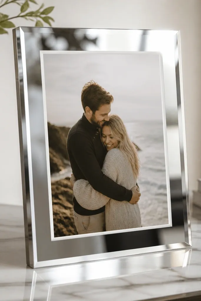 A modern frame made from mirror-finish acrylic edges. A frosted white tape border surrounds the photo opening like a thin frame line. The photo sits behind the acrylic and the overall look is sleek and reflective.