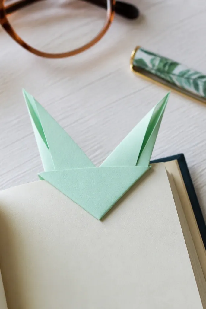 Bookmark with bunny ears and a folded page-holding pocket