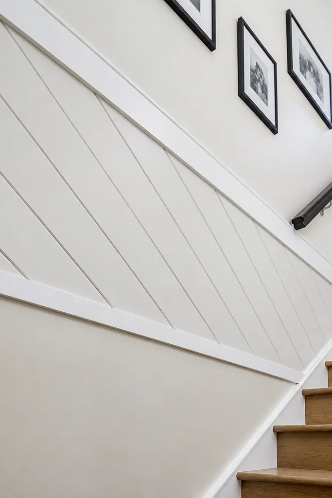 White wall with diagonal panel band framed by straight rails
