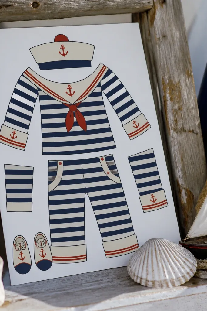 Paper doll in a sailor dress with anchor accents