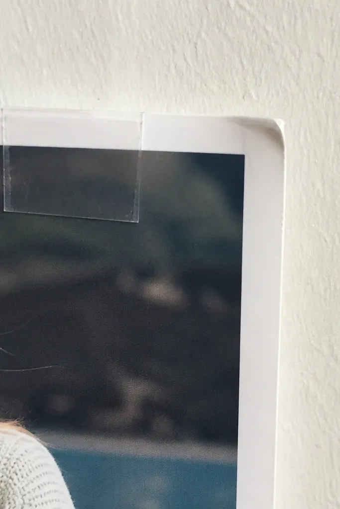 Tiny tear at border where tape was applied