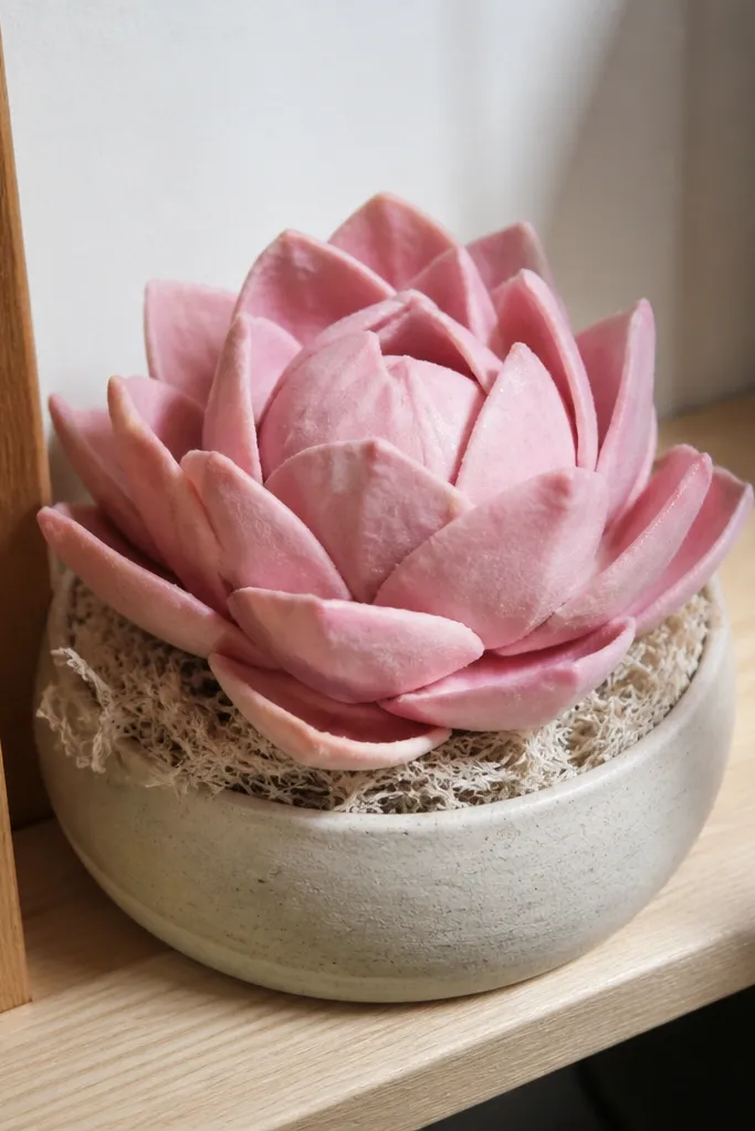 Paper rose squishy with layered petals and a pink center