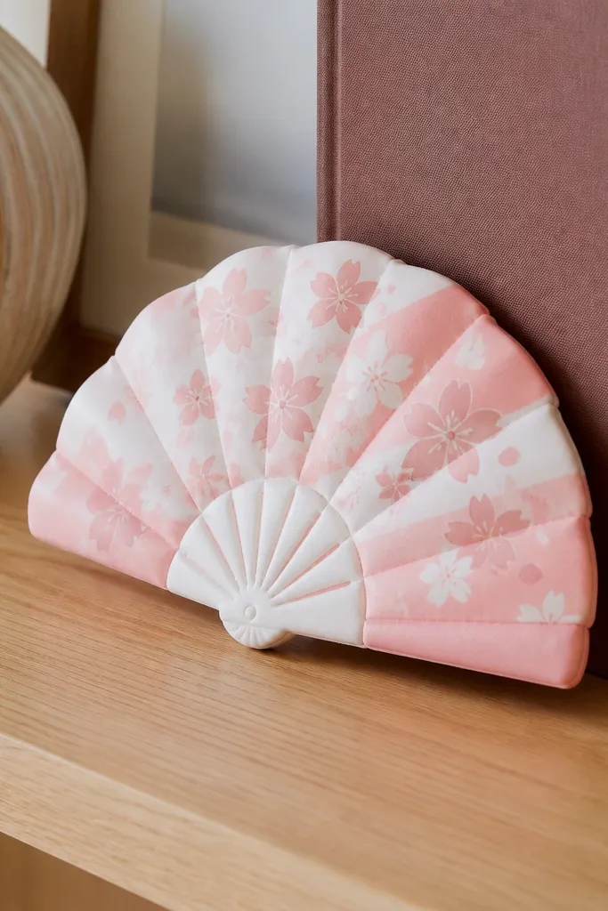 Cherry blossom fan squishy with pink petals and a soft curved shape