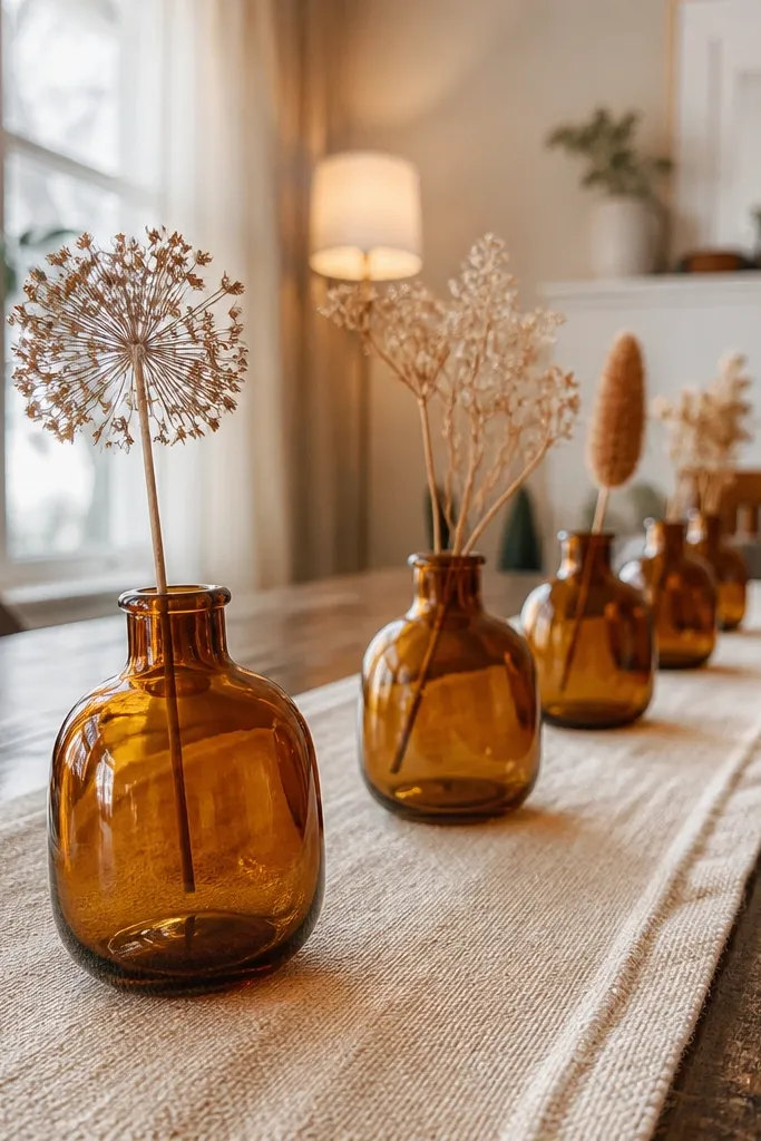 Tray with a small runner and three amber glass bud vases