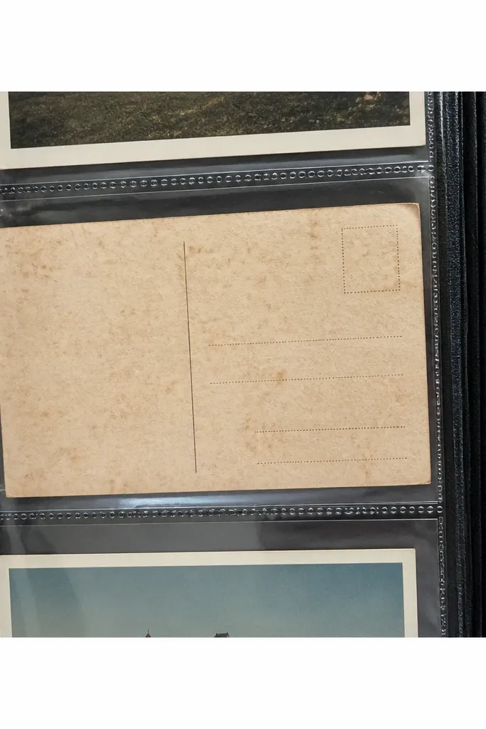 A cream postcard-back pattern with faint dividing lines and stamp box marks.