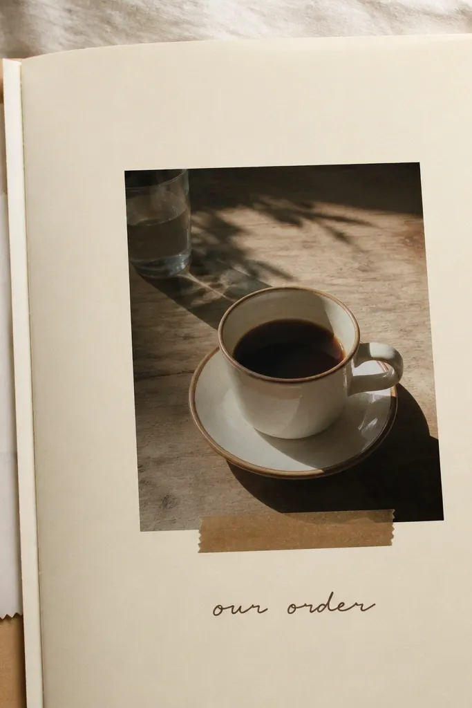 A cream page with a coffee cup photo in the center. Two receipt tabs are tucked on the left like bookmarks. A small strip of brown washi tape runs under the photo, and "our order" is written in dark brown.