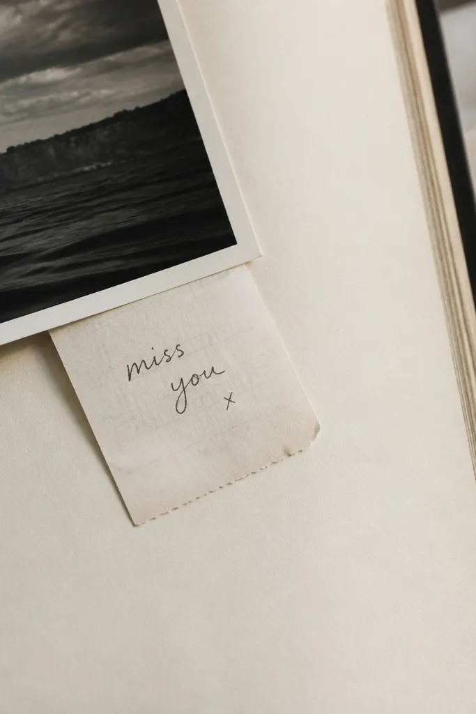 A page with a photo in the top corner and a receipt tucked under the photo edge, visible like a mini secret. The receipt has a handwritten note on it.